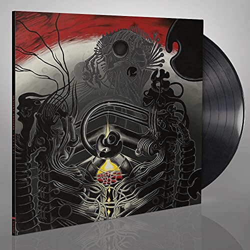 Vinyl record with dark, surrealist cover art featuring organic and mechanical forms.