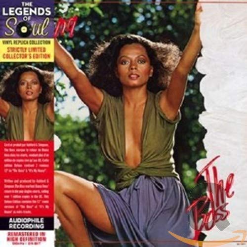 Diana Ross in green top and purple skirt with arms raised on album cover.