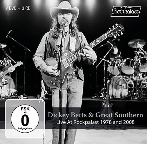 Dickey Betts with guitar on stage, album cover for live recordings.