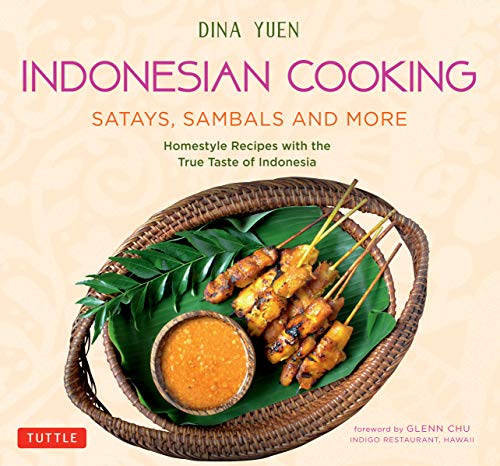 Cookbook cover featuring chicken satays with peanut sauce on a woven tray.
