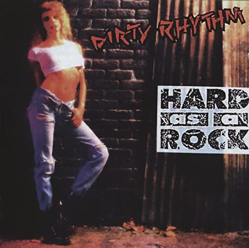 CD cover: woman in jeans leaning against a brick wall.