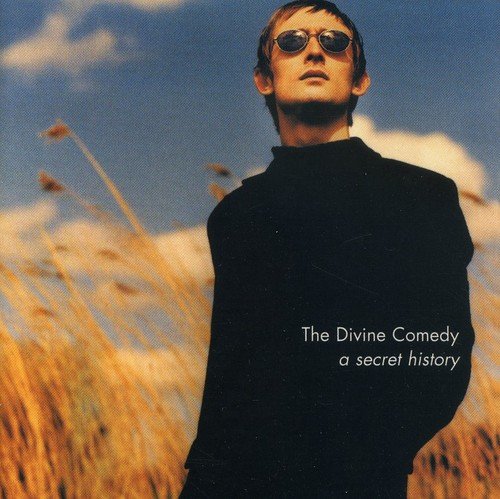 CD cover: man in sunglasses stands in a golden field.