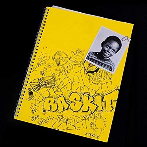 Yellow notebook with a photo and "Raskit" graffiti-style text.