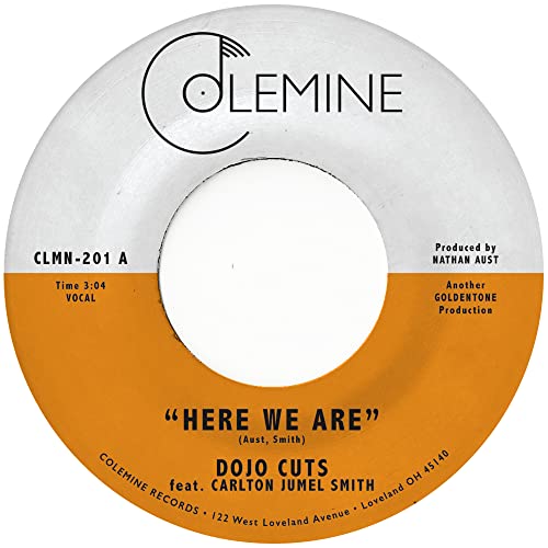Orange and white vinyl record label for Dojo Cuts’ “Here We Are.”