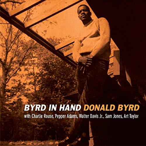 Donald Byrd stands outdoors in a sepia-toned album cover for Byrd in Hand.