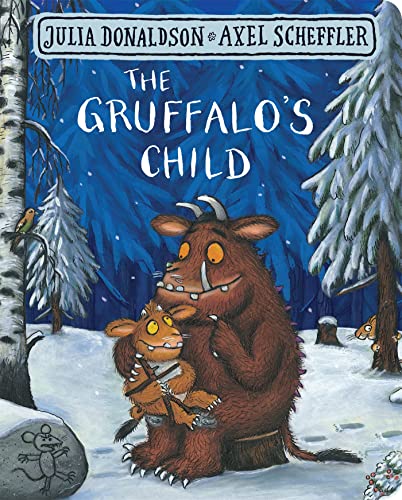 The Gruffalo holding his child in a snowy forest, title text above.