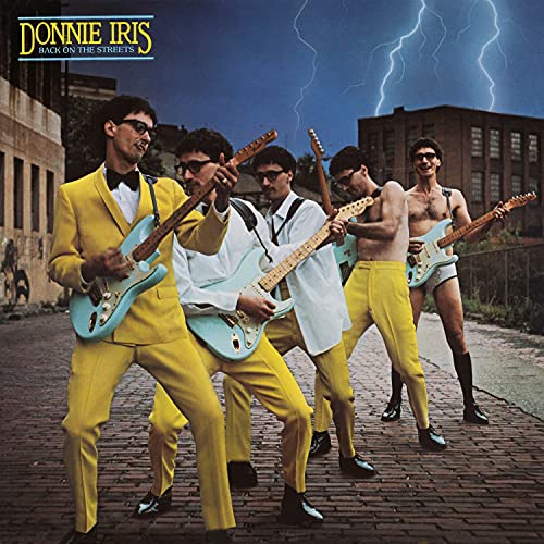 Donnie Iris album cover: band in suits and casual wear on street.