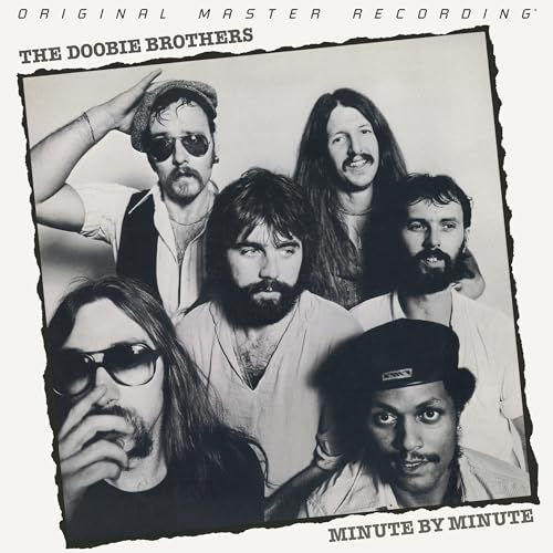 Black and white photo of The Doobie Brothers, album cover for "Minute By Minute.