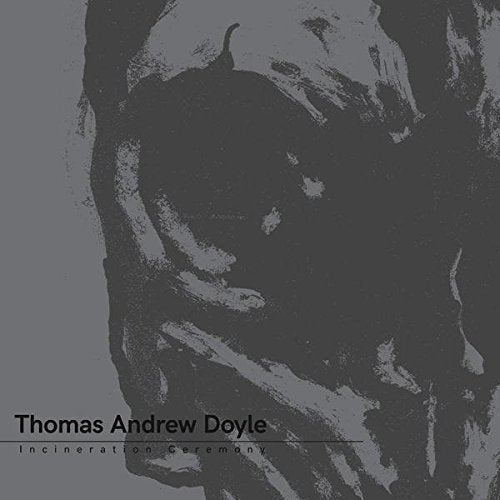 Dark grey album cover with abstract black design and artist's name at the bottom.