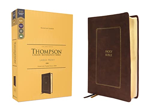 Brown leather-look Bible with gold-edged pages, shown with its gold box.