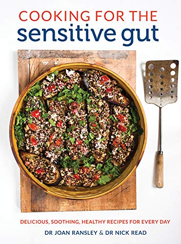 Cookbook cover featuring stuffed aubergine and cooking utensils on wood.