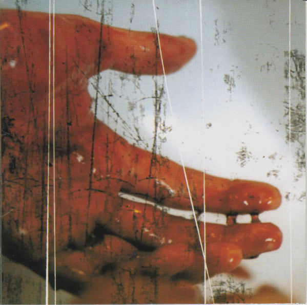 CD cover with abstract image of a hand and red texture.