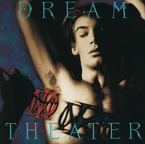 Album cover featuring a man with a red logo and black geometric chest design.