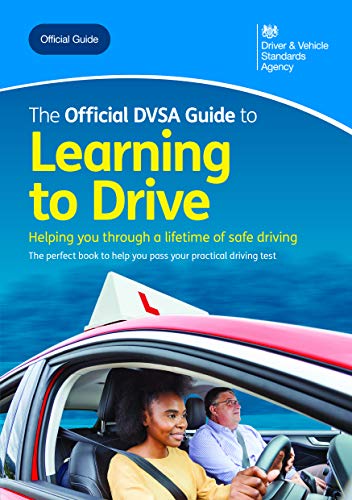 "Blue book cover with a young woman driving and an instructor beside her."