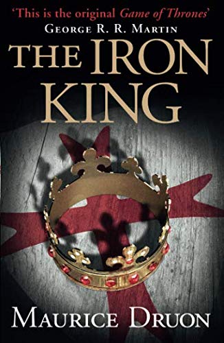 Book cover with gold crown and red cross on a wooden background.