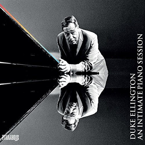 Black and white portrait of Duke Ellington at a piano, album cover.