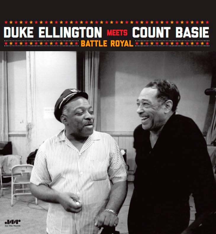 Black and white photo of Duke Ellington and Count Basie smiling.