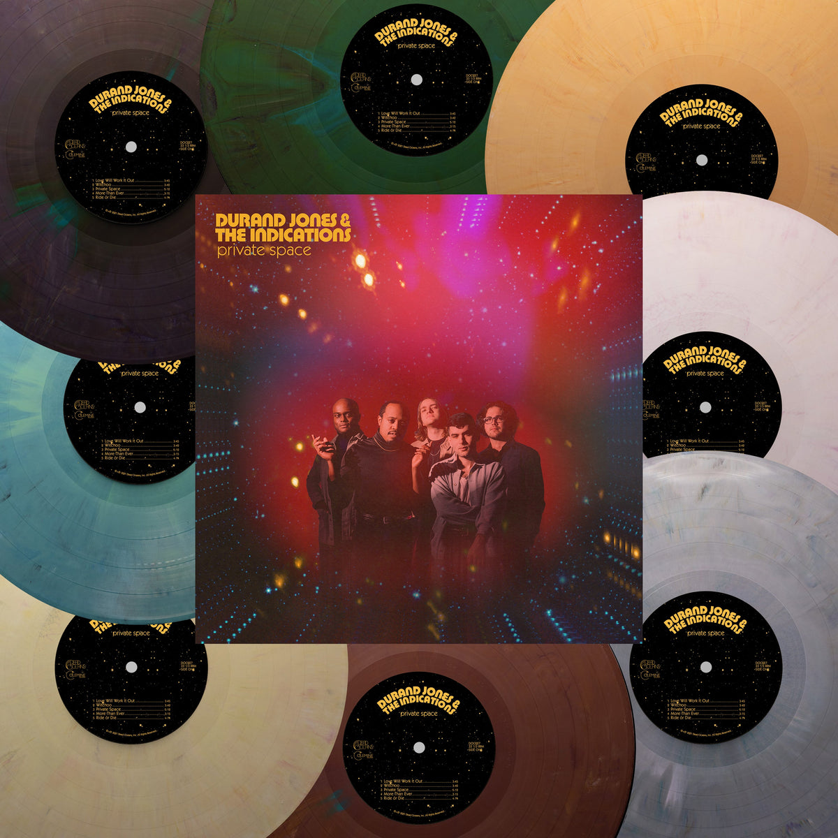 Album cover with band photo surrounded by various colored vinyl records.