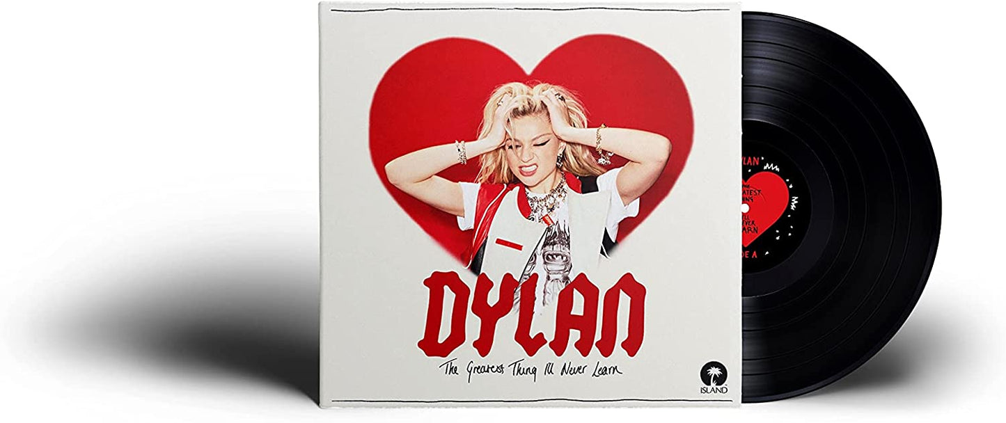A vinyl record with a white sleeve featuring a blonde woman in a red heart.