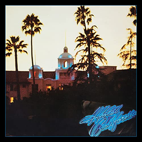 Hotel California album cover with palm trees and a building at sunset.