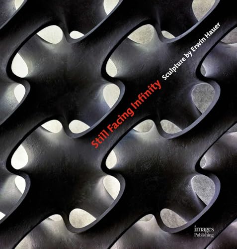 Close-up of dark, abstract metal sculpture with repeating curved shapes.