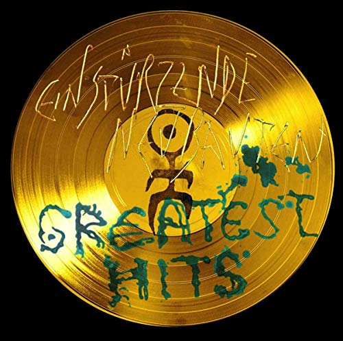 Gold vinyl record with handwritten text: "Einsturzende Neubauten - Greatest Hits".