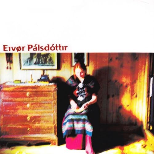 CD cover featuring a woman in traditional Icelandic clothing indoors.