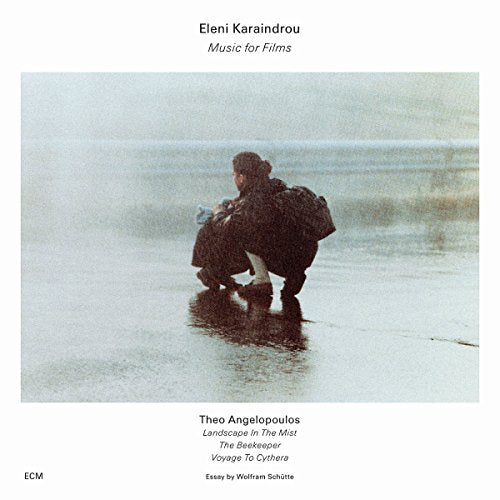CD cover: blurry image of a person on a beach, text details.