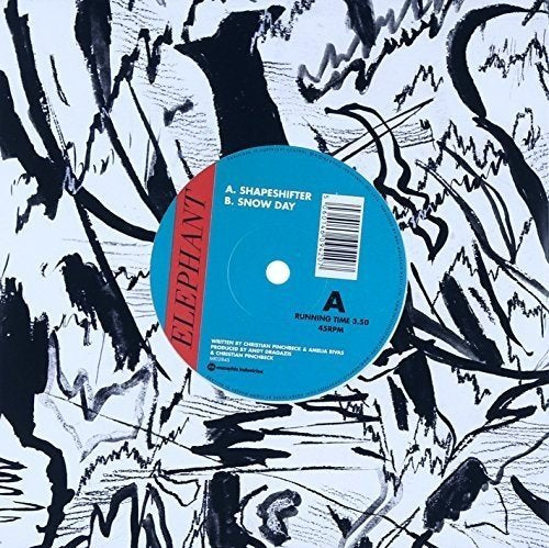 Blue vinyl record with "Elephant" label on abstract black and white background.