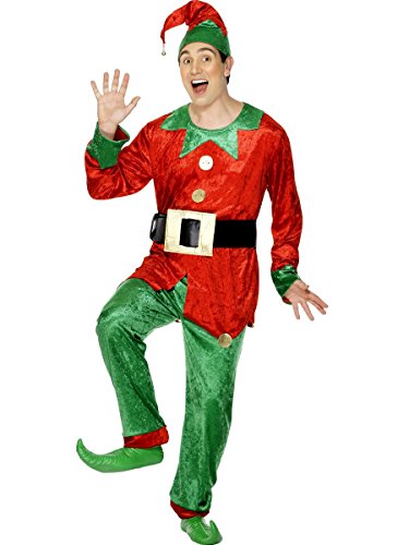 Man wearing a red and green elf costume, smiling and waving.