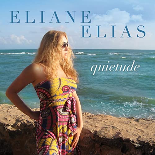 Eliane Elias album cover, woman by the ocean, blue sky.