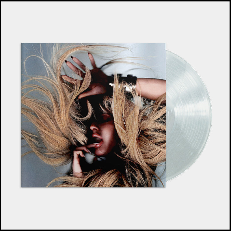 Ellie Goulding album cover with flowing blonde hair and a pearl vinyl record.