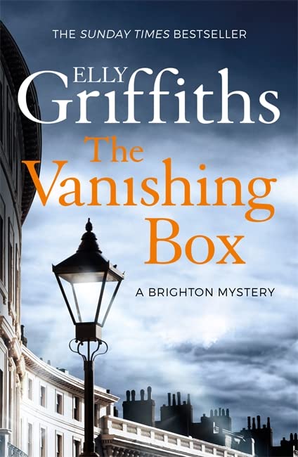 Book cover featuring a street lamp against a cloudy sky and Victorian buildings.