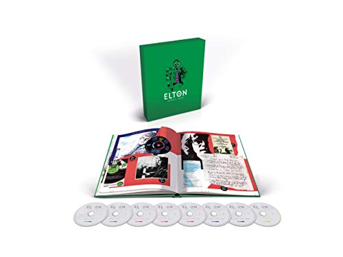 "Elton John Jewel Box CD case and eight discs on a purple background."