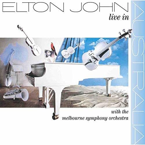 Elton John album cover featuring a piano, violins, and a bird.