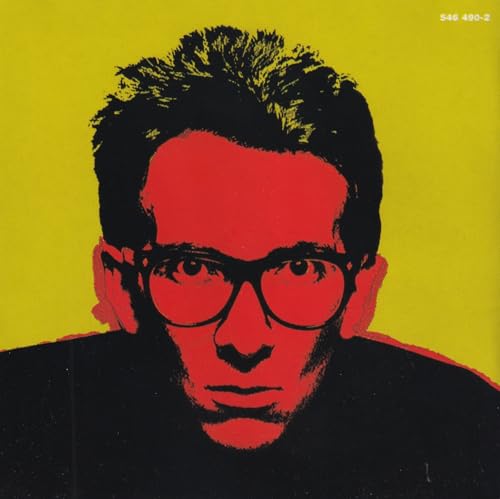Stylized portrait of Elvis Costello in red and black against a yellow background.