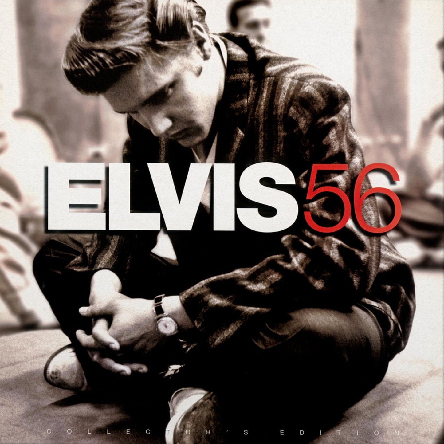 Elvis Presley album cover, "Elvis 56," featuring a seated young Elvis.