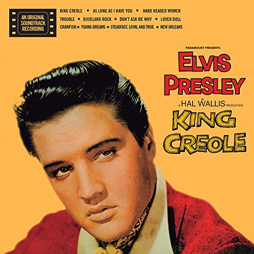 Elvis Presley portrait on a yellow background for the King Creole soundtrack album cover.