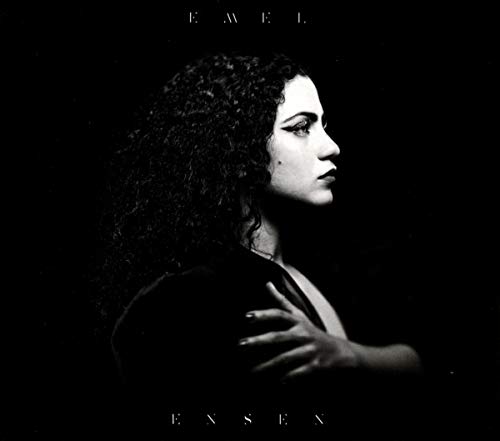 Black and white album cover featuring a woman in profile with curly hair.