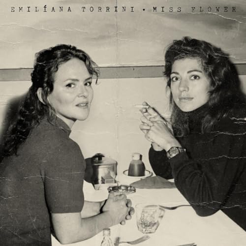 Black and white album cover featuring Emiliana Torrini, split portrait.
