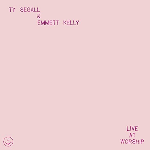 Pink album cover with smiling faces and “Live At Worship” text.