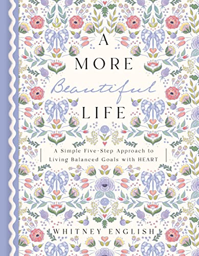 Book cover with floral design and title "A More Beautiful Life.