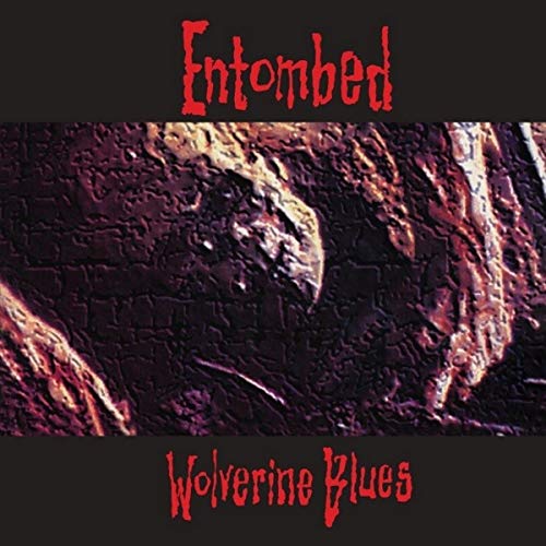 Album cover for Entombed’s “Wolverine Blues” with textured, dark imagery.