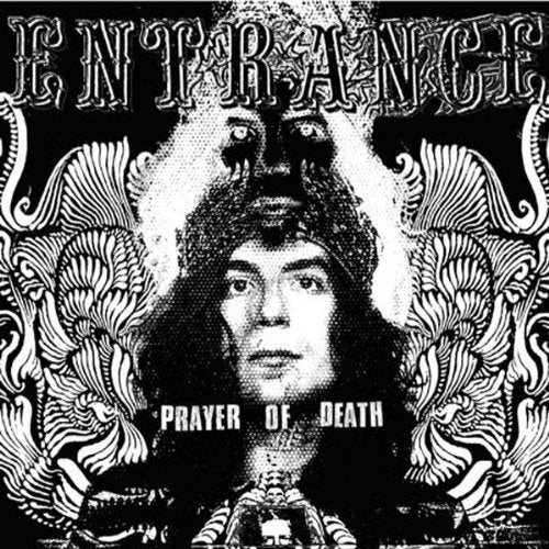 CD cover: dark, ornate design featuring a man’s face and swirling patterns.