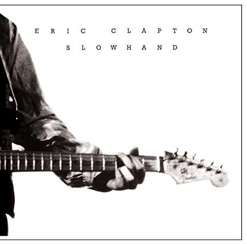 Eric Clapton’s “Slowhand” album cover: a guitarist with a guitar.