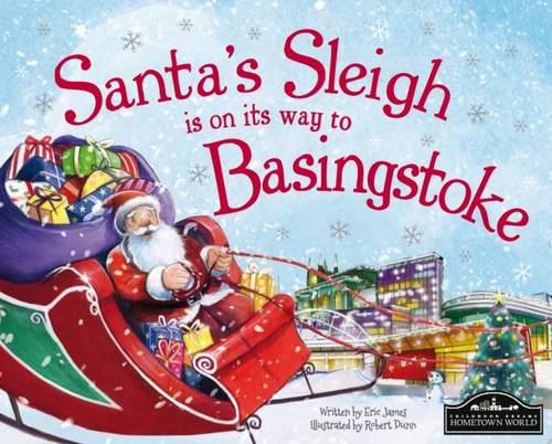 Santa in a red sleigh flying over a town at night.