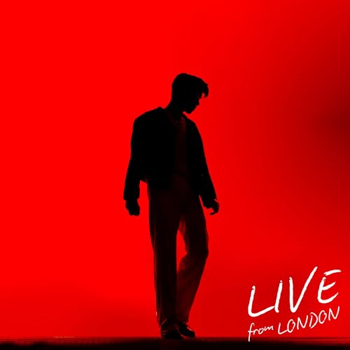 Silhouette of Eric Nam standing against a bright red background with white text.