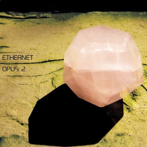 "CD cover with a pink crystal on a sandy surface, 'Ethernet Opus 2' text."