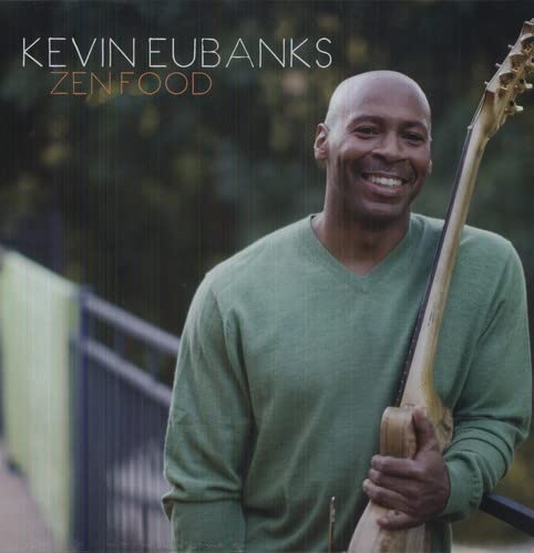 Kevin Eubanks smiling, holding a double bass, album cover for "Zen Food".