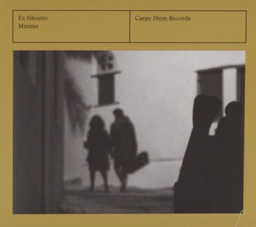 A monochrome album cover with a gold background, featuring a blurry black-and-white photograph.